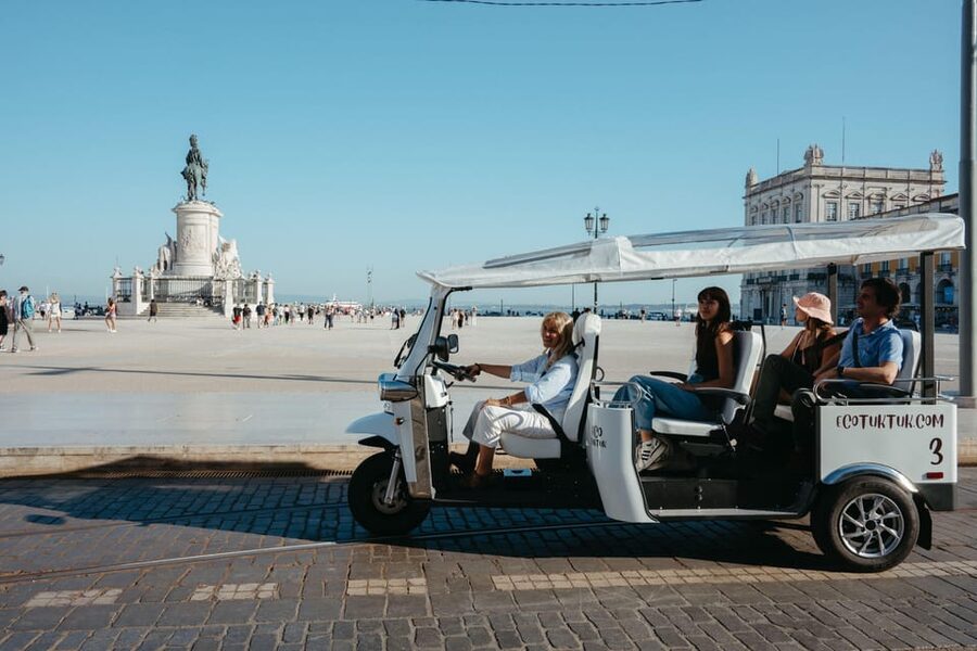 Belém: Private City Tour by Eco Tuk Tuk - Crossing the riverfront with the 25 de Abril Bridge in view