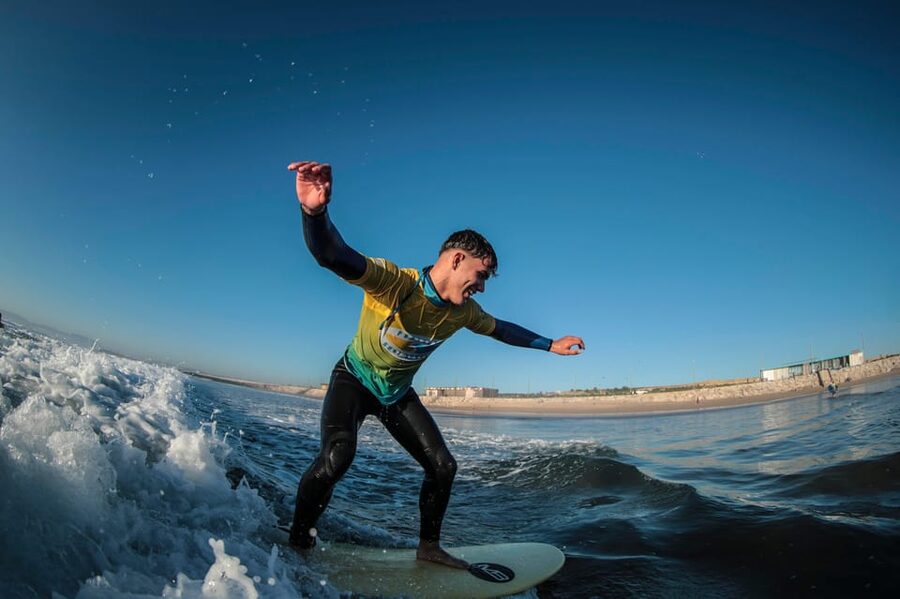 Costa da Caparica: Sunset Surf Lesson - Getting fitted with the surf equipment