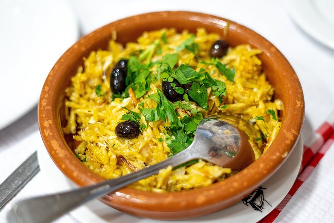 Devour Lisbon: The Ultimate Portuguese Food Tour - O Trevo explains the power of the bifana