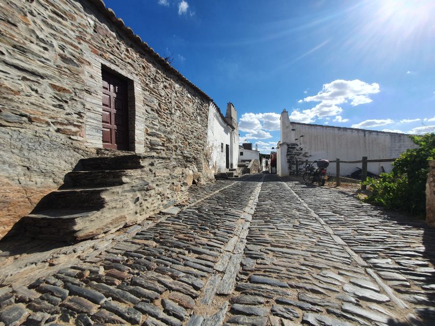 From Lisboa: Evora and Monsaraz Full-Day Tour - The Royal Palace and market add everyday texture