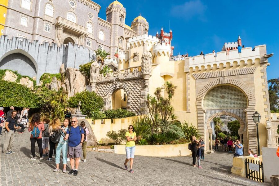 From Lisbon: Best of Sintra and Cascais Guided Day Tour - Entering Pena Palace above the Sintra Hills