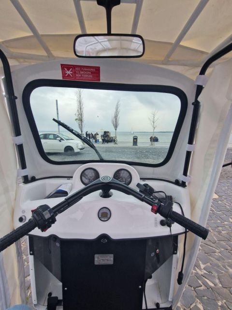 Full city of Lisbon on board of a private car - Alfama brings the old streets close