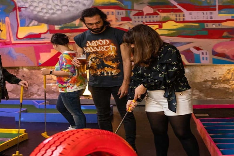Lisbon: 18-Hole Indoor Minigolf Ticket with Bar Area - The first nine holes and the natural-light artwork