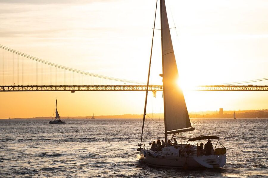 Lisbon: Alfama Charms, Tapas, Wine and Sunset Boat Cruise - Walking through Alfama’s steep, winding lanes
