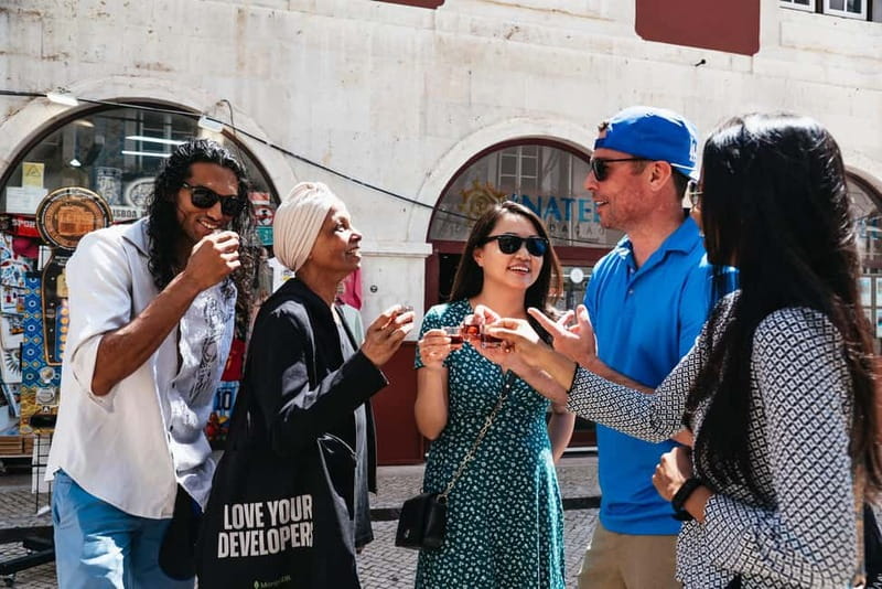 Lisbon: Baixa District Food Tour with Dinner and Drinks - Grilled sardine and seafood rice