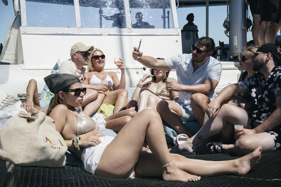 Lisbon: Catamaran Boat Party with Music, Open Bar & Dives - Weather, timing, and practical planning
