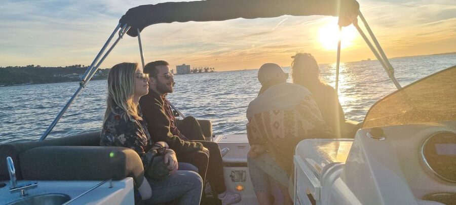 Lisbon: City Boat Cruise Daytime/Sunset/Night with Champagne - Military vessels and riverfront landmarks