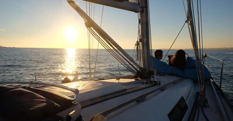 Lisbon: City Skyline Sailboat Cruise with Drink and Snacks - Under the 25 de Abril Bridge