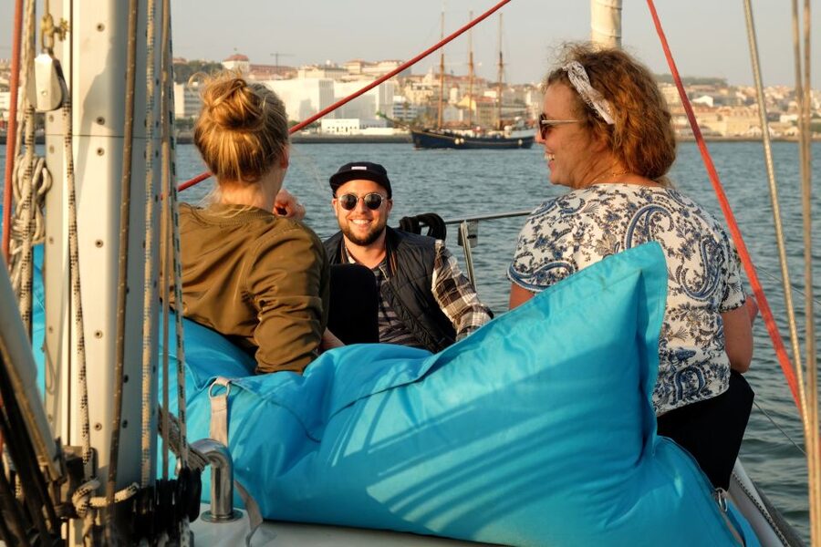 Lisbon: City Skyline Sailboat Cruise with Drink and Snacks - Sunset light, weather, and comfort