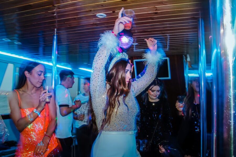 Lisbon: Disco Night Cruise with DJ and Open Bar - Passing beneath the 25 de Abril Bridge
