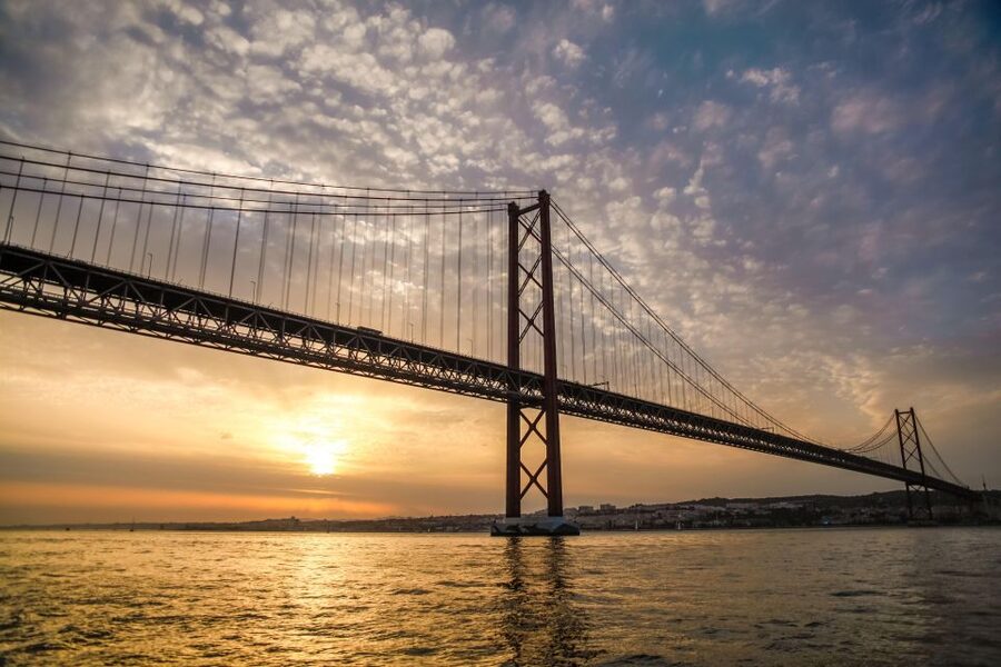 Lisbon: Disco Night Cruise with DJ and Open Bar - Christ the King across the river