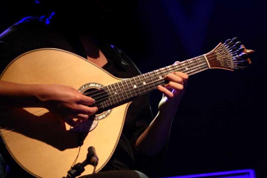 Lisbon: Fado Night Tour - Crossing the 25 de Abril Bridge after dark