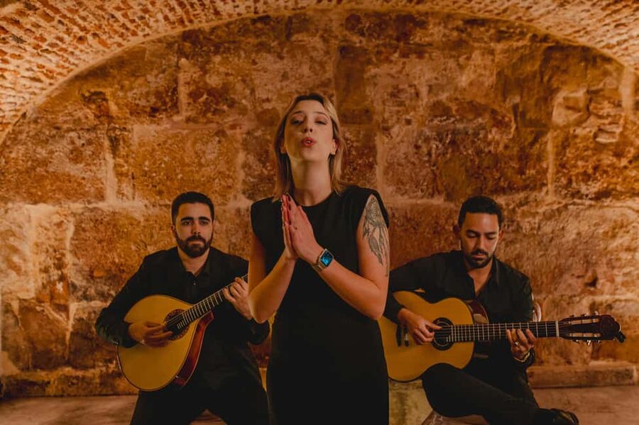 Lisbon: Fado Show with Wine in a Historic Venue - What the old stone room adds