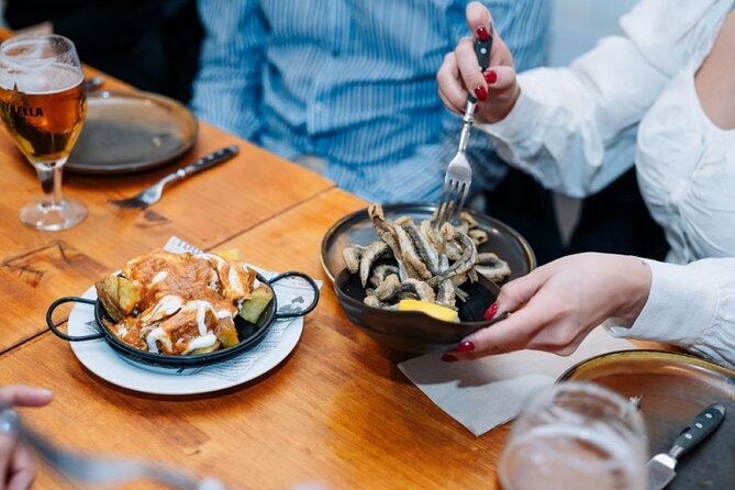 Lisbon Food Tour with Portuguese Wine: Taste the Best of Portugal - Presunto, Alentejo cheese, and octopus salad in Rua dos Fanqueiros