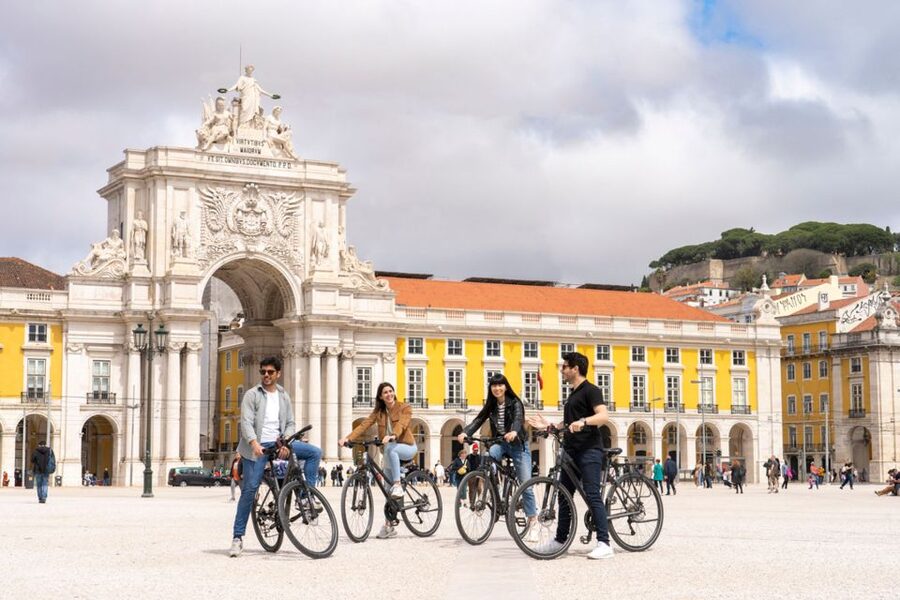 Lisbon: Guided Bike Tour, Helicopter Flight, and Boat Trip - Starting in Rossio Square and walking into old Lisbon