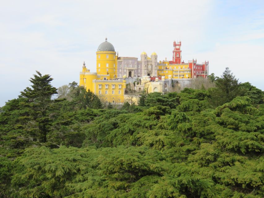 Lisbon: Pena, Regaleira & Atlantic Coast Tour with a Local - Pena Palace, color, and royal stories