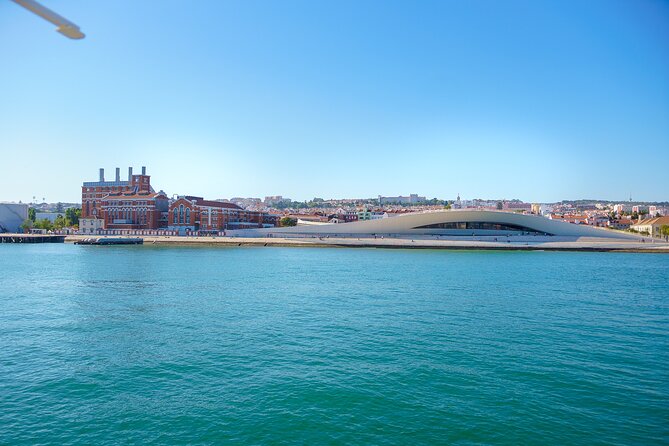 Lisbon River Boat Sightseeing Tour with a Drink - Christ the King and the southern bank complete the picture