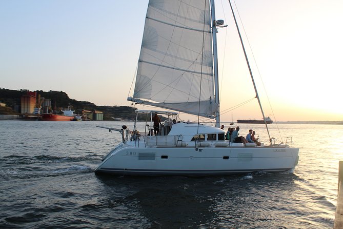 Lisbon Sailing Catamaran Public Cruise with drinks - Praça do Comércio opens the view