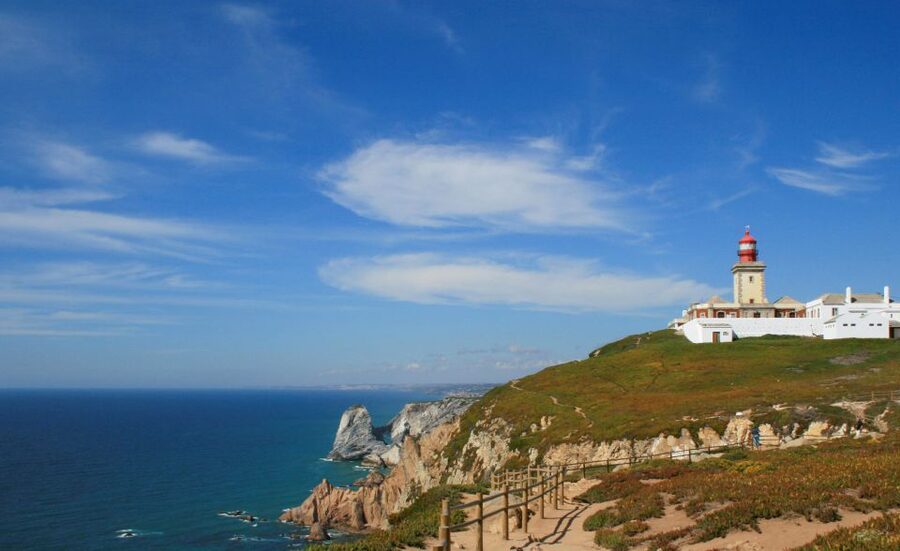 Lisbon: Sintra, Pena Palace, Quinta Regaleira, Cascais Tour - Passing Queluz before the mountain