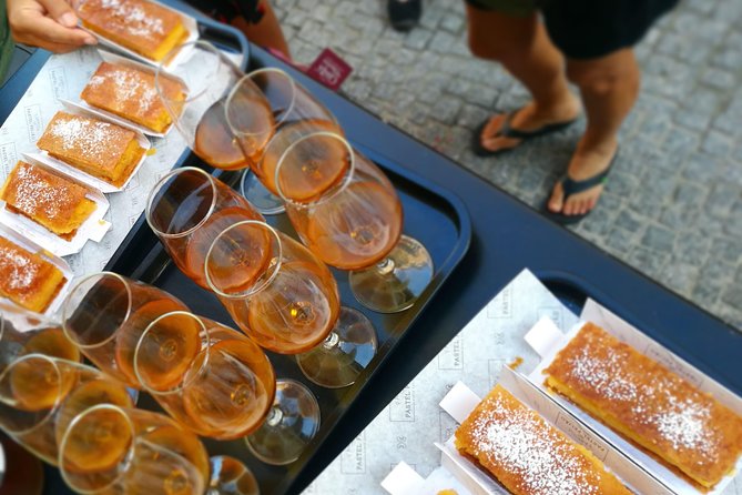 Lisbon Small-Group Food Tour with 18 Tastings in Alfama District - Eighteen tastings, from cod cakes to Portuguese wine