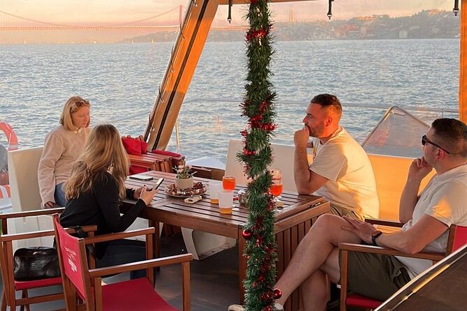 Lisbon: Sunset Catamaran Boat Tour with Music and Drinks - Picking between the nets and the covered terrace