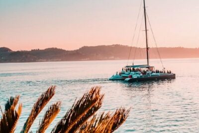 Sunset Catamaran Boat Tour with Music and Drinks