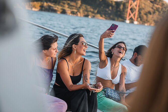Lisbon: Sunset Catamaran Boat Tour with Music and Drinks - Music, drinks, and the social mood onboard