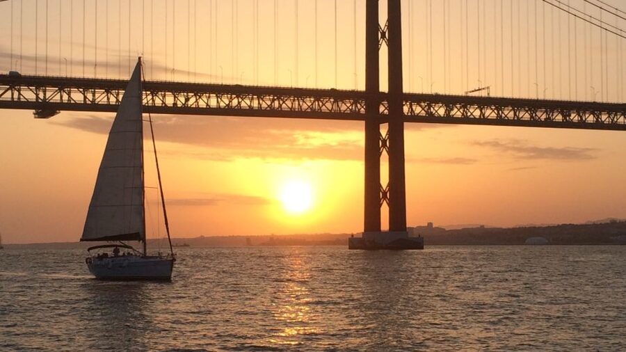 Lisbon: Sunset Cruise with Drinks and Snacks - Sailing beneath the 25 de Abril Bridge