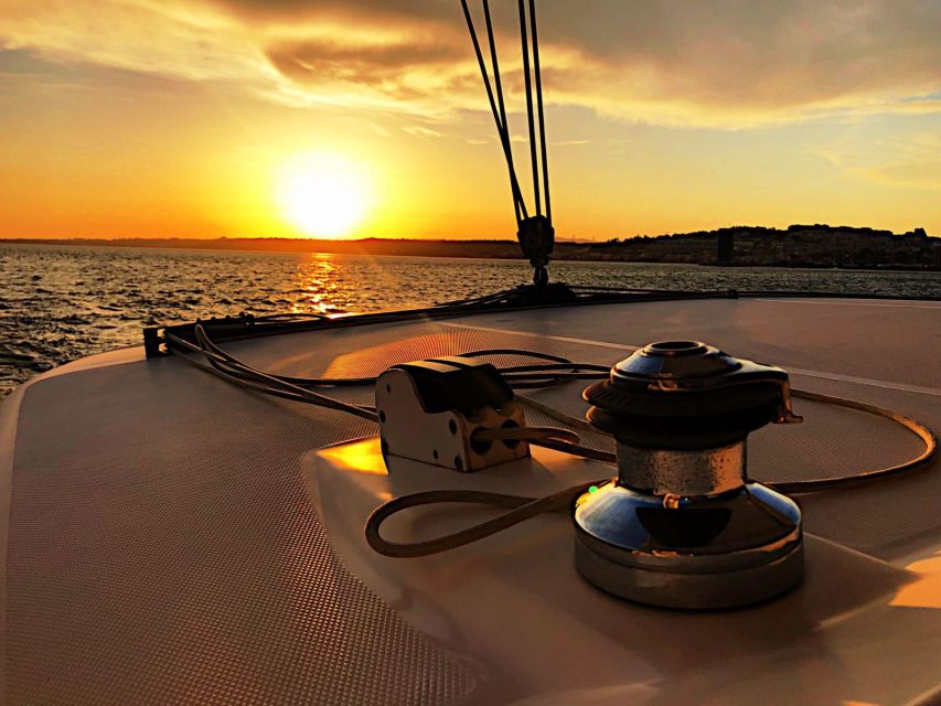 Lisbon: Sunset Cruise With Drinks on Spacious Yacht - What the crew adds to the experience