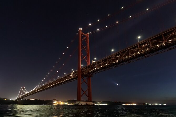 Lisbon – Sunset DJ & Porto Tonic Premium Boat Experience - Cristo Rei across the water