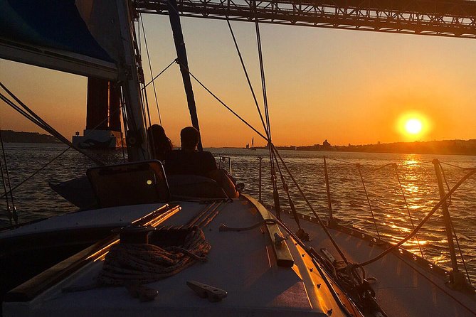 Lisbon Sunset Sailing Tour with White or Rosé Wine and Snacks - Under the 25 de Abril Bridge