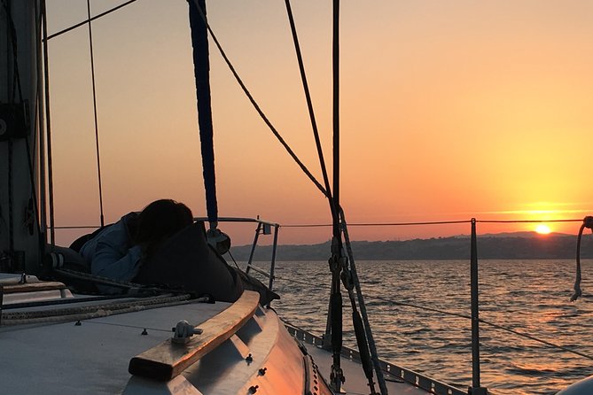 Lisbon Sunset Sailing Tour with White or Rosé Wine and Snacks - Wine, snacks, and the social side of the sail
