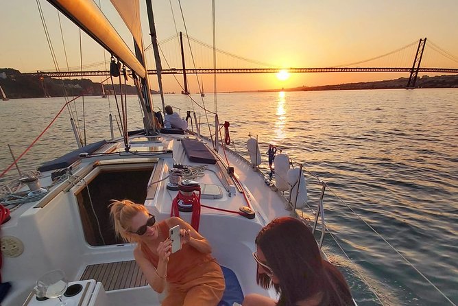 Lisbon Sunset Sailing with Portuguese Wine and History - Under the 25th April Bridge