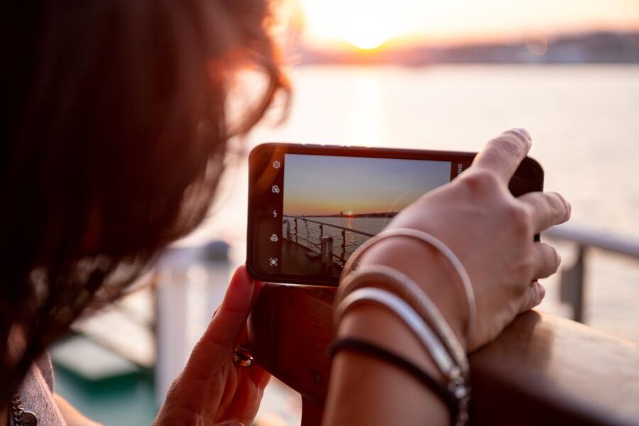 Lisbon: Tagus River Sunset Tour with Snacks and Drink - Alfama’s colorful buildings from the water