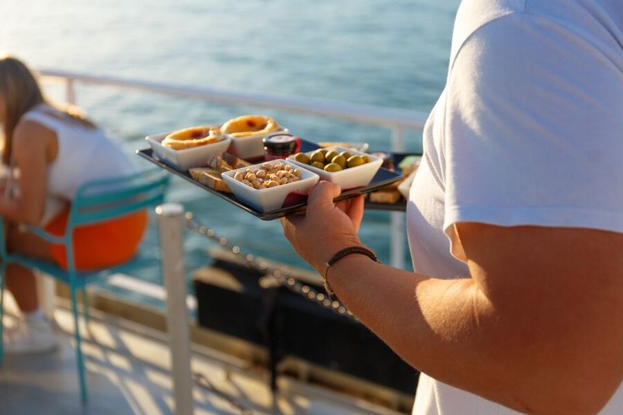 Lisbon: Tagus River Sunset Tour with Snacks and Drink - Passing under the 25th of April Bridge