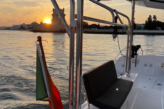 LUXURY Catamaran Sunset and Wine cruise - Crossing toward the bridge and central Lisbon