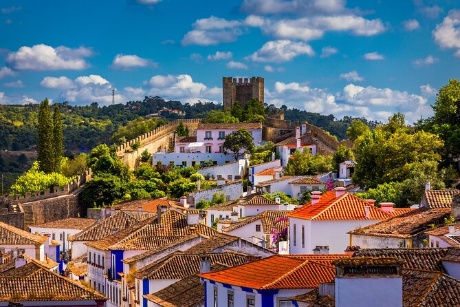 Three Cities in One Day: Porto, Nazare and Obidos from Lisbon - Nazaré: ocean cliffs, pilgrimage sites, and wave watching